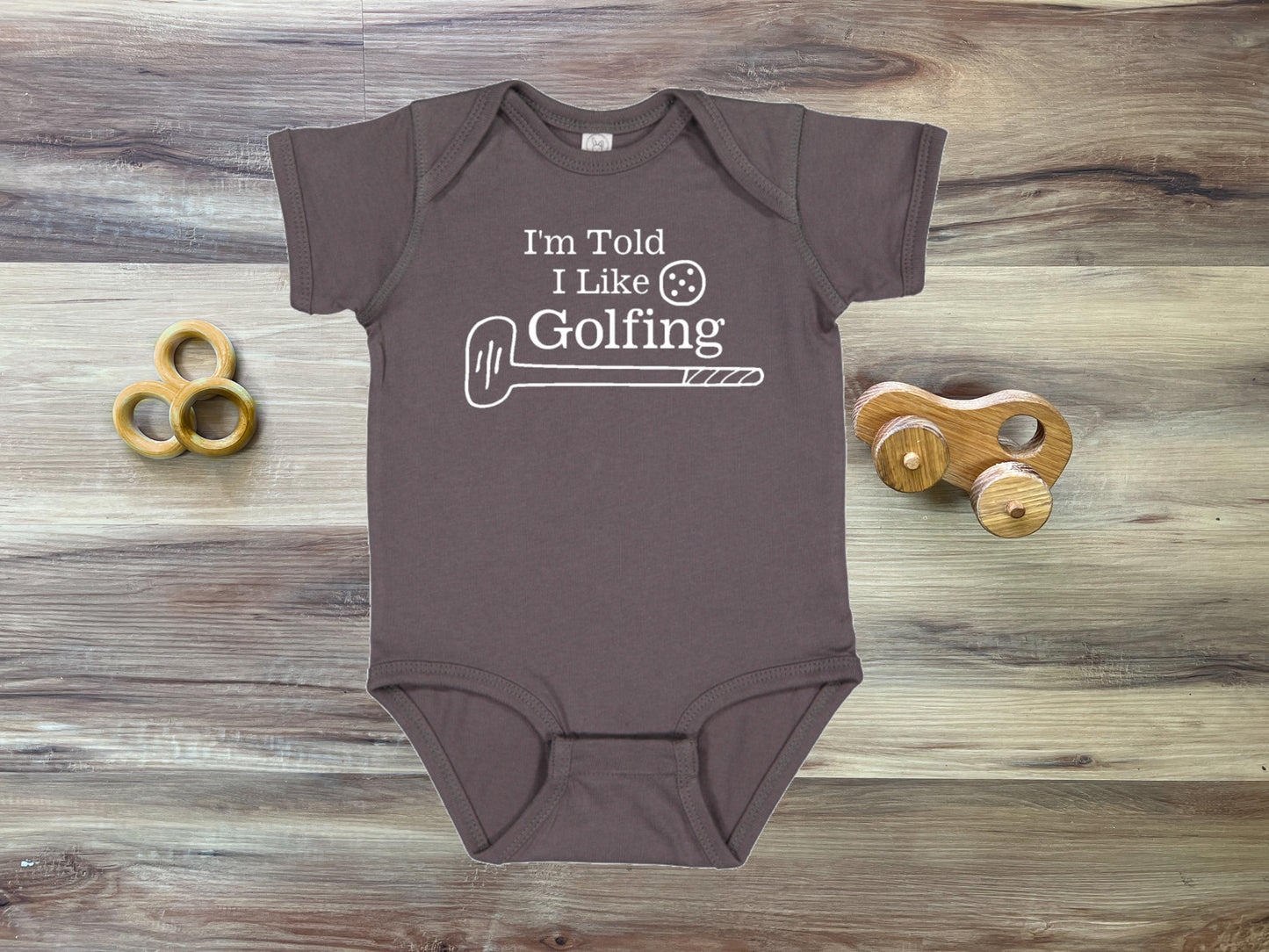 I'm Told I Like Golfing Silhouette Baby Bodysuit
