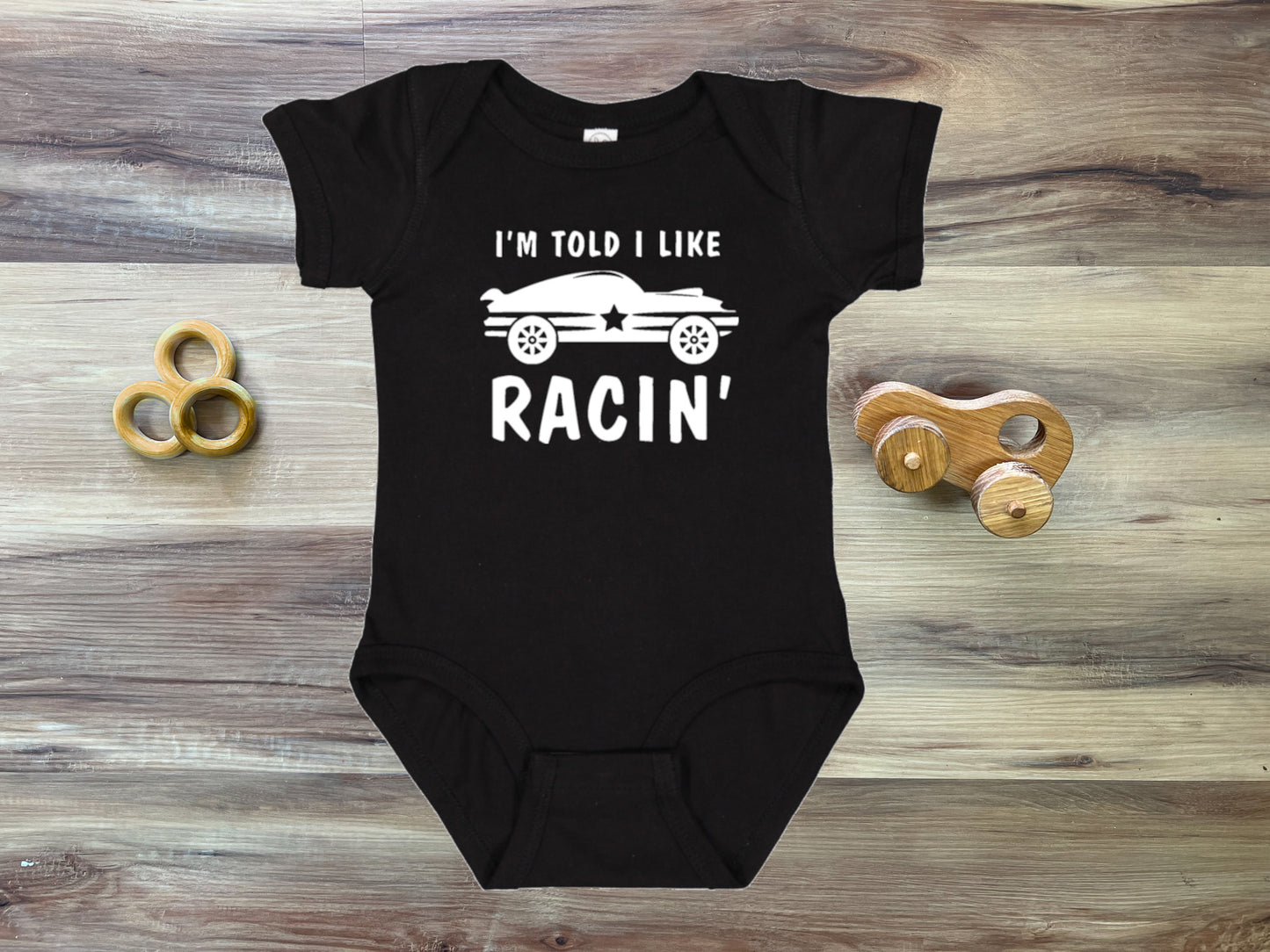 I'm Told I Like Racin' Silhouette Baby Bodysuit