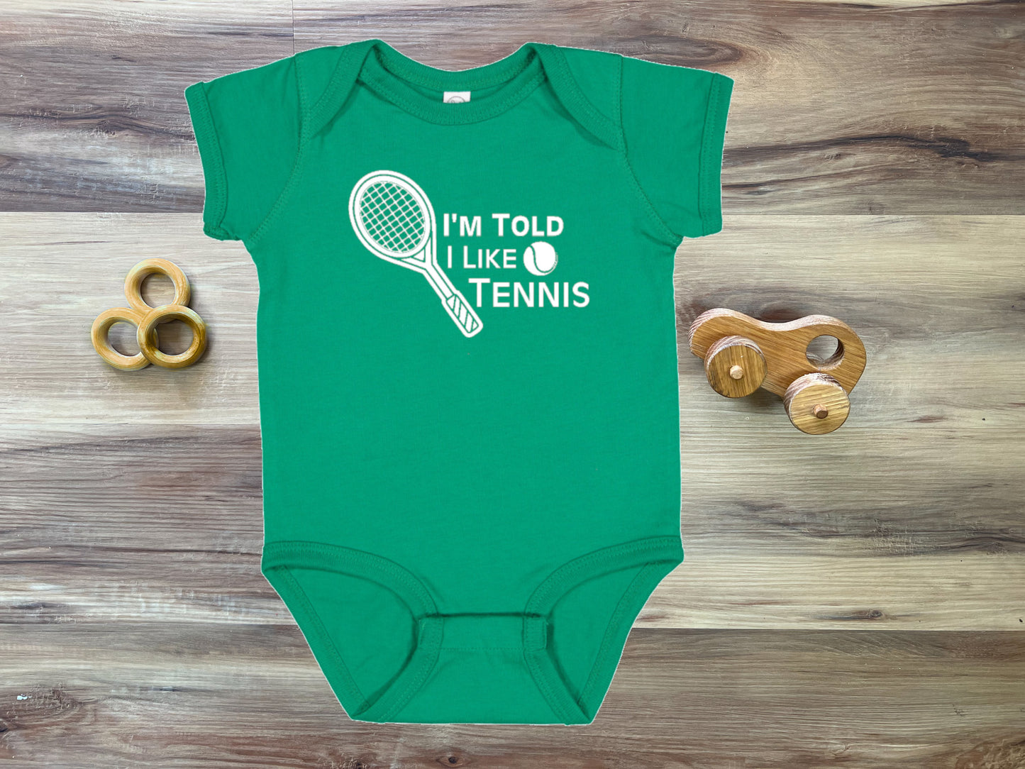 I'm Told I Like Tennis Silhouette Baby Bodysuit