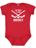 I'm Told I Like Hockey Silhouette Baby Bodysuit