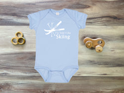 I'm Told I Like Skiing Silhouette Baby Bodysuit