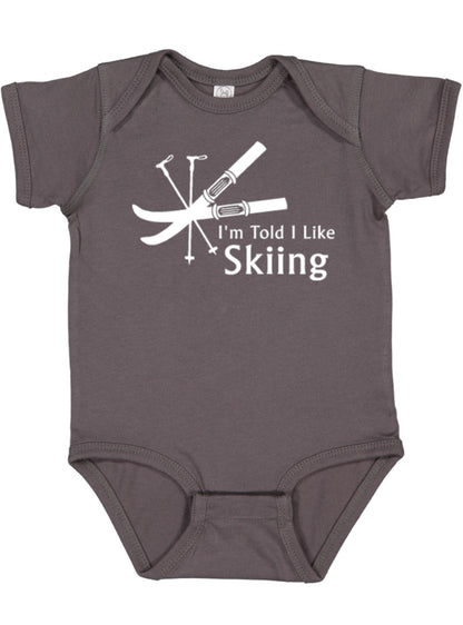 I'm Told I Like Skiing Silhouette Baby Bodysuit